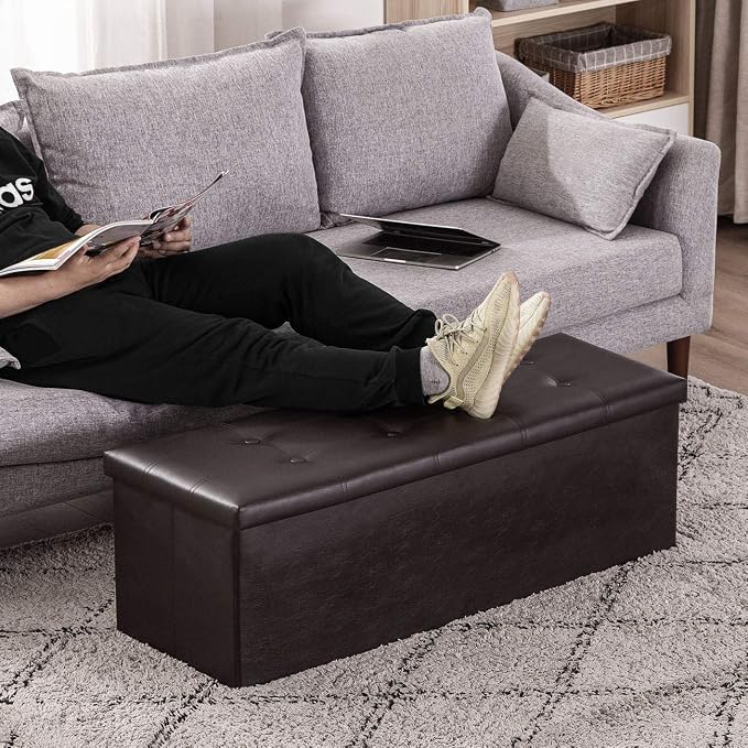 YOUDENOVA 43" Ottoman with Storage, Folding Faux Leather Bench, Brown | Foldable ottoman with hidden storage, padded faux leather seat and sturdy MDF frame for everyday use.