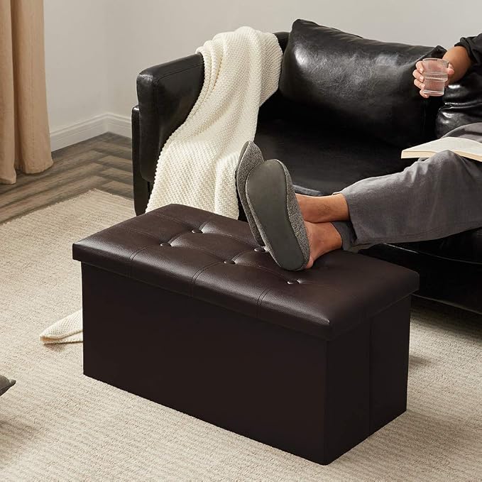 YOUDENOVA 30" Ottoman with Storage, Folding Faux Leather Bench, Brown | Foldable ottoman with hidden storage, padded faux leather seat for living room, bedroom and entryway.