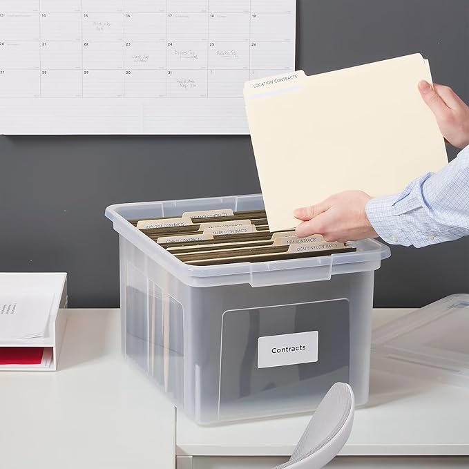 STAPLES Plastic File Box with Snap Lid, Letter/Legal Size, Clear, 4/Carton | Stackable storage box keeps hanging files organized and protected. Pack of 4.