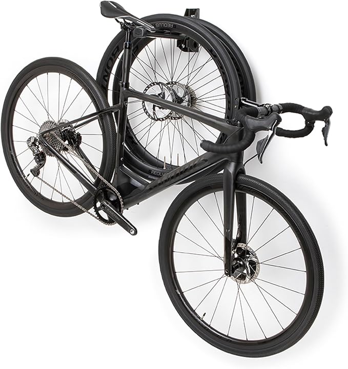 Feedback Sports Velo Wall Post Bike Storage Mount + Bike Wheel Storage | Fold-away post saves wall space while holding bikes or wheels; rubber-coated arms protect frame finishes