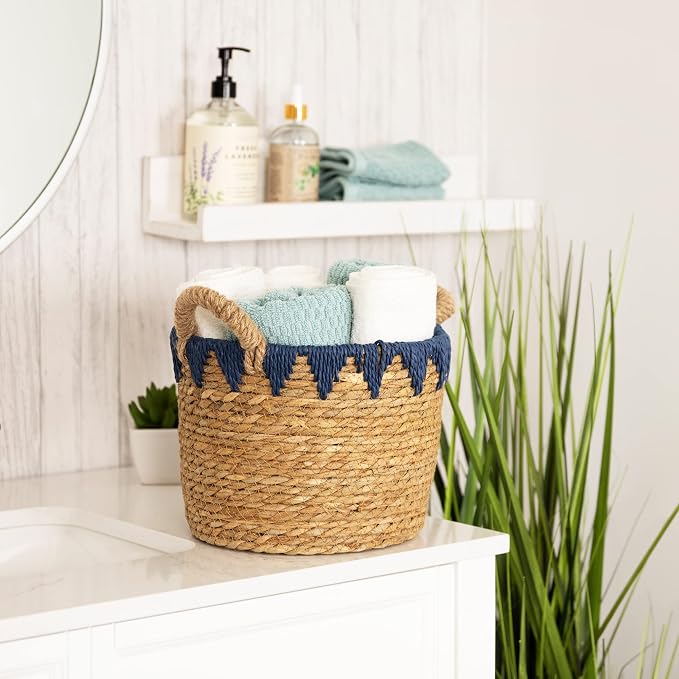 Stratton Home Decor Woven Straw Decorative Storage Basket | Rustic Wicker Basket for Storing Essentials | Natural Colored Blanket Basket with Blue Details | 10.0”x10.0”x10.0”