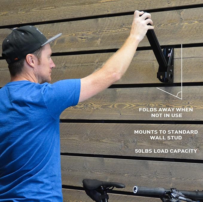 Feedback Sports Velo Wall Post Bike Storage Mount + Bike Wheel Storage | Fold-away post saves wall space while holding bikes or wheels; rubber-coated arms protect frame finishes